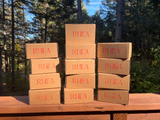rhea skincare shipping boxes photographed outside in the pnw